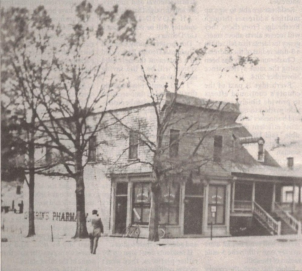Before c. 1910 – 1920: Guerin’s Pharmacy before its brick front